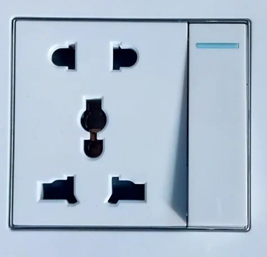 A Chinese wall socket with a switch — compatible with Type A (two flat pins) and Type I (three pins), all running at 220V
