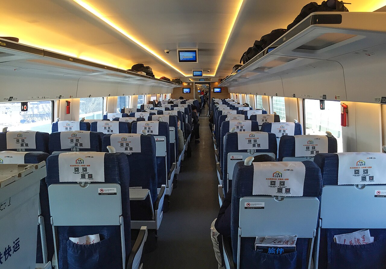 Inside a CR400BF Fuxing train - a spotless second class carriage with rows of comfortable seats